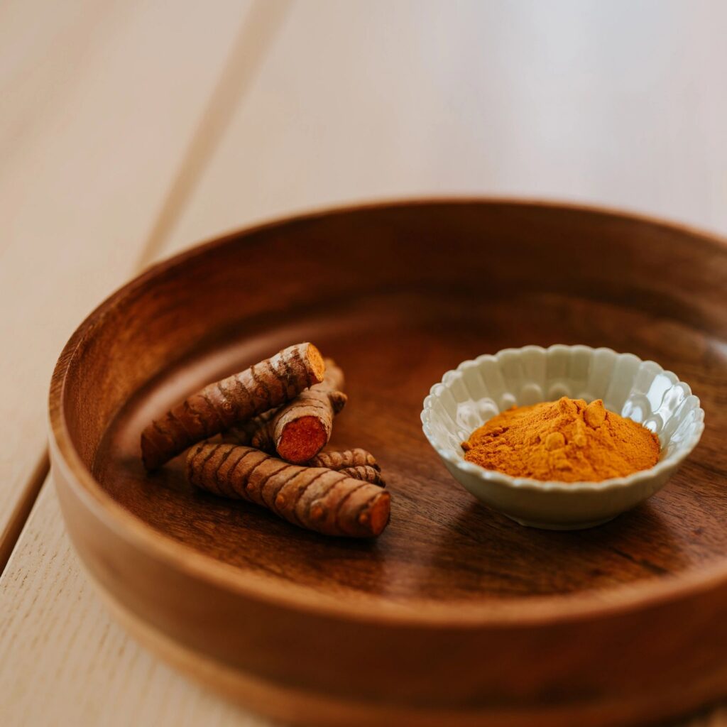 Healthy food still life Turmeric root and powder Curcuma longa